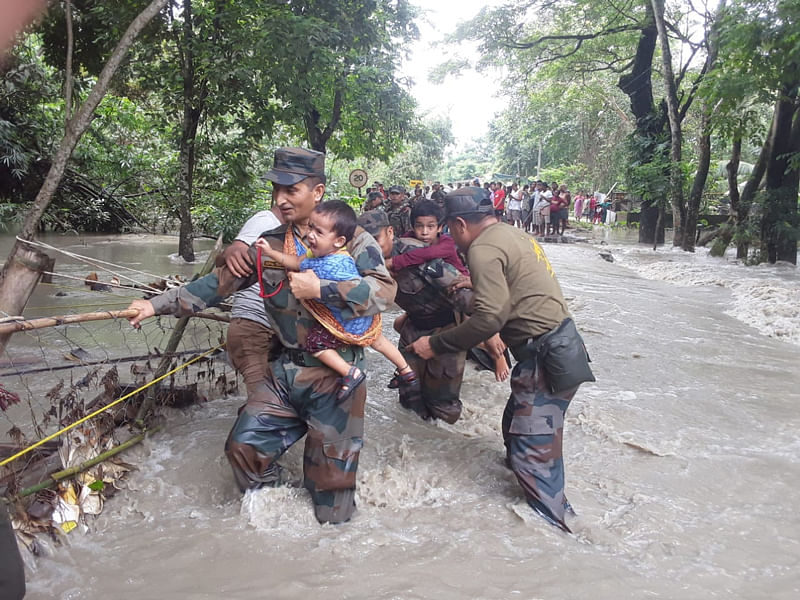 Army personnel rescuing flood hit people in Nalbari district in western Assam on Wednesday. (Photo credit: Army)