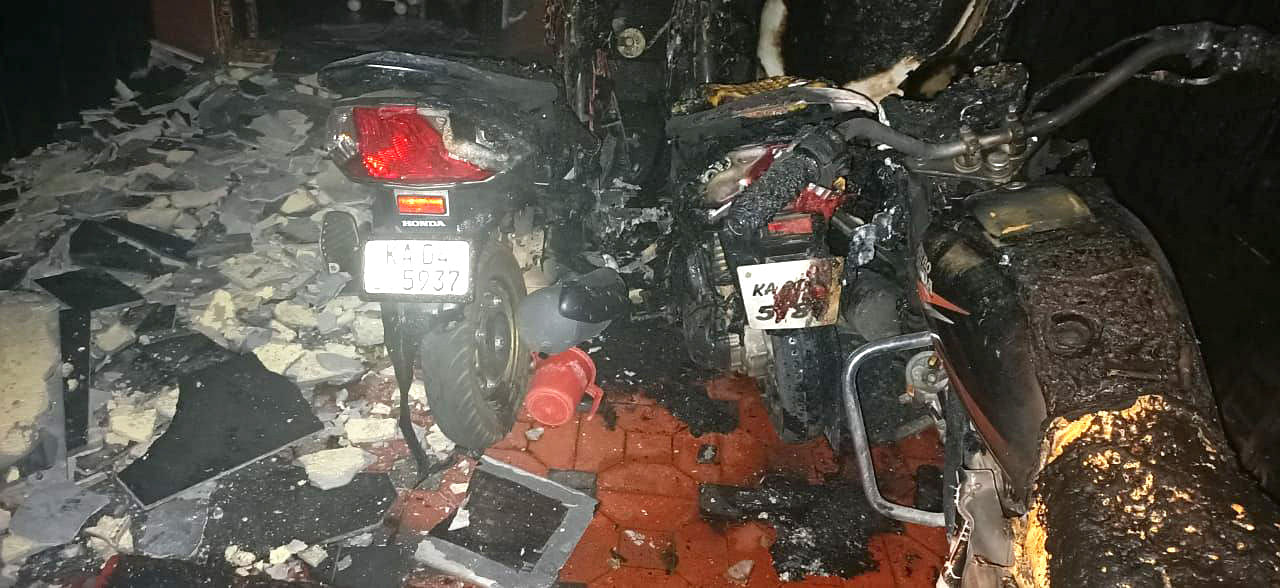 Burnt two wheelers were set up fire by the two persons on parked vehicles outside of the house to threatened the house owner after he refused to pay 50 lakhransom demanded them on Monday night.