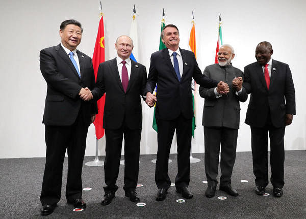 Russia's President Vladimir Putin (2nd L), Brazil's President Jair Bolsonaro (C), India's Prime Minister Narendra Modi (2nd R), China’s President Xi Jinping (L) and South Africa's President Cyril Ramaphosa pose for a picture during the BRICS summit in Osaka. (Reuters photo)