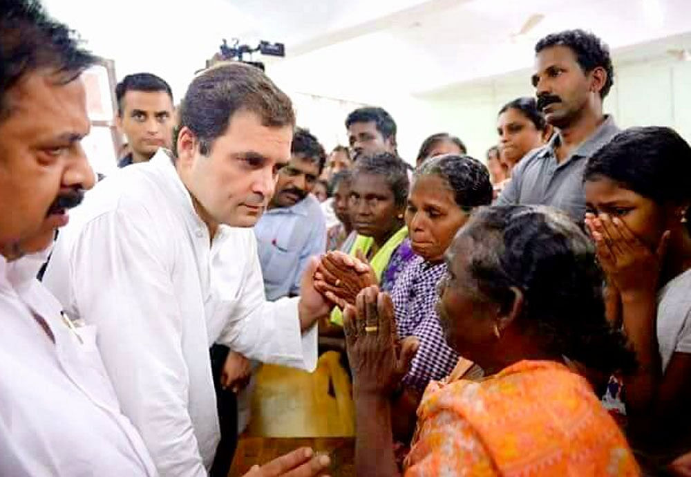 Rahul Gandhi interacts with the flood victims in Chengannur, Alappurzha, Kerala on Tuesday. (Photo credit: Twitter/@INCIndia)