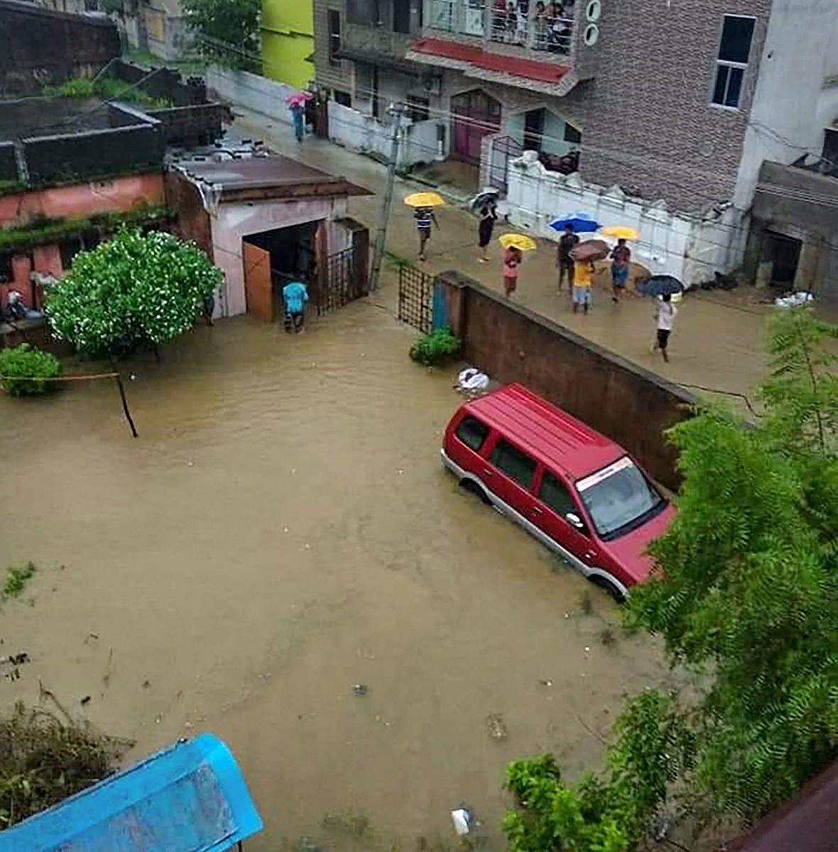 Balangir: Cars and houses submerged in floodwater following heavy monsoon rain, in Balangir district of Odisha, Wednesday, Aug 14, 2019. (PTI Photo)
