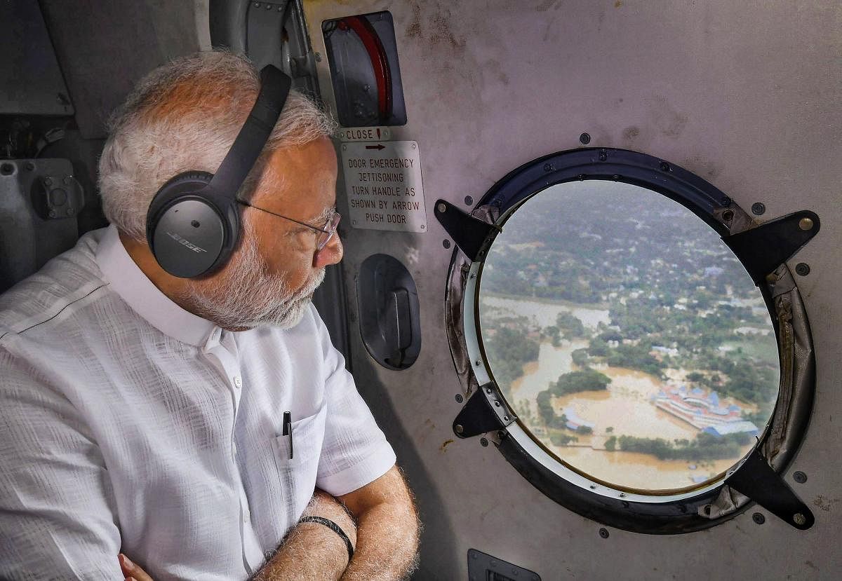 Prime Minister Narendra Modi conducts an aerial survey of flood-affected areas in Kerala on Saturday. PTI