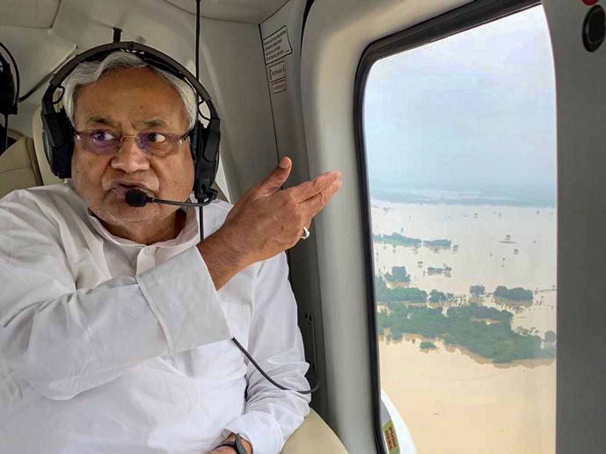 Bihar Chief Minister Nitish Kumar takes an aerial survey of the flood-affected districts of Bihar (PTI Photo)