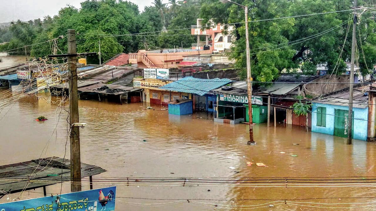  A view of Malaprabha river water flooding the Munavalli village after heavy rain, in Belgavi, Wednesday, Aug 7, 2019. (PTI Photo)