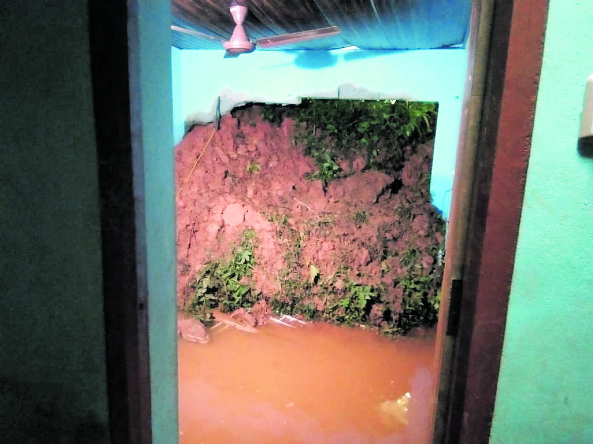 Soil from landslide has entered a house at Nandikadu.