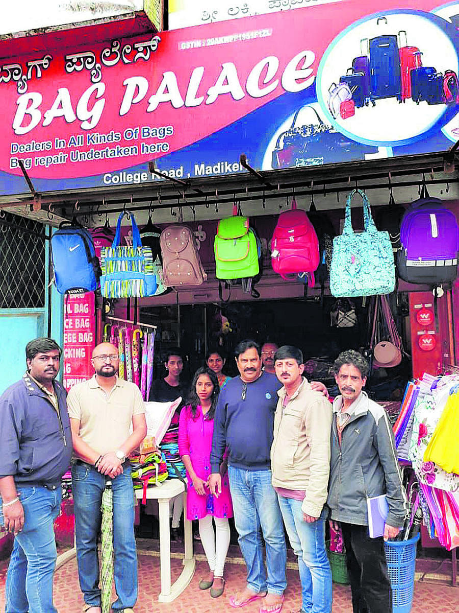 Madikeri Hitharakshana Vedike members with Bag Palace owner E J Peter (third from right).