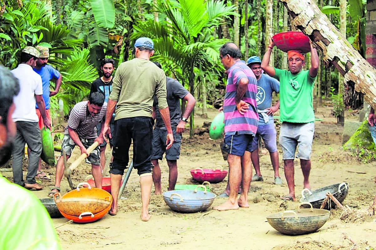 Members of Sahyadri Sanchaya took part in a Shramadan to remove the silt deposited  at Raju Gowda’s areca plantation near Karyandoor Thodu in Didupe on Sunday. 