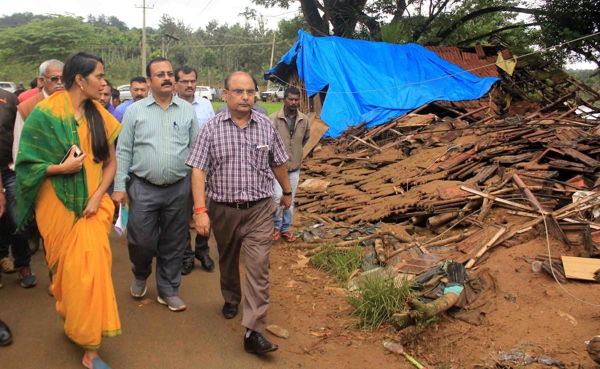 Deputy Commissioner Annies Kanmani Joy takes the Central team on a tour of the flood-affected area in Karadigodu village near Siddapura in Kodagu district on Tuesday.