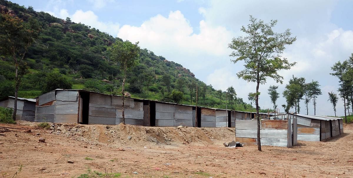 The tin-sheds built for those who lost houses at Gokak, Belagavi district, locals allege, are poorly built and lack basic facilities. | DH Photo: Pushkar