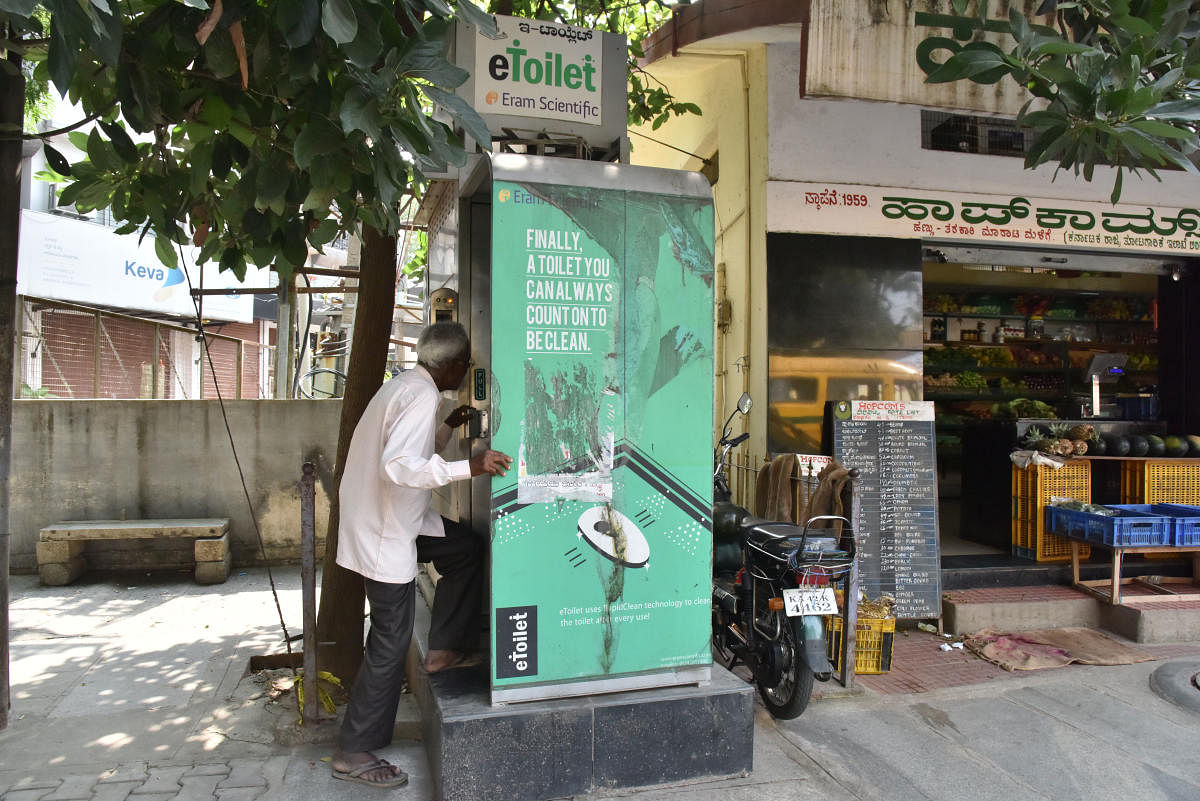 Senior citizens are among those who try to use the e-toilet in Basavanagudi near Ramakrishna Ashrama. 