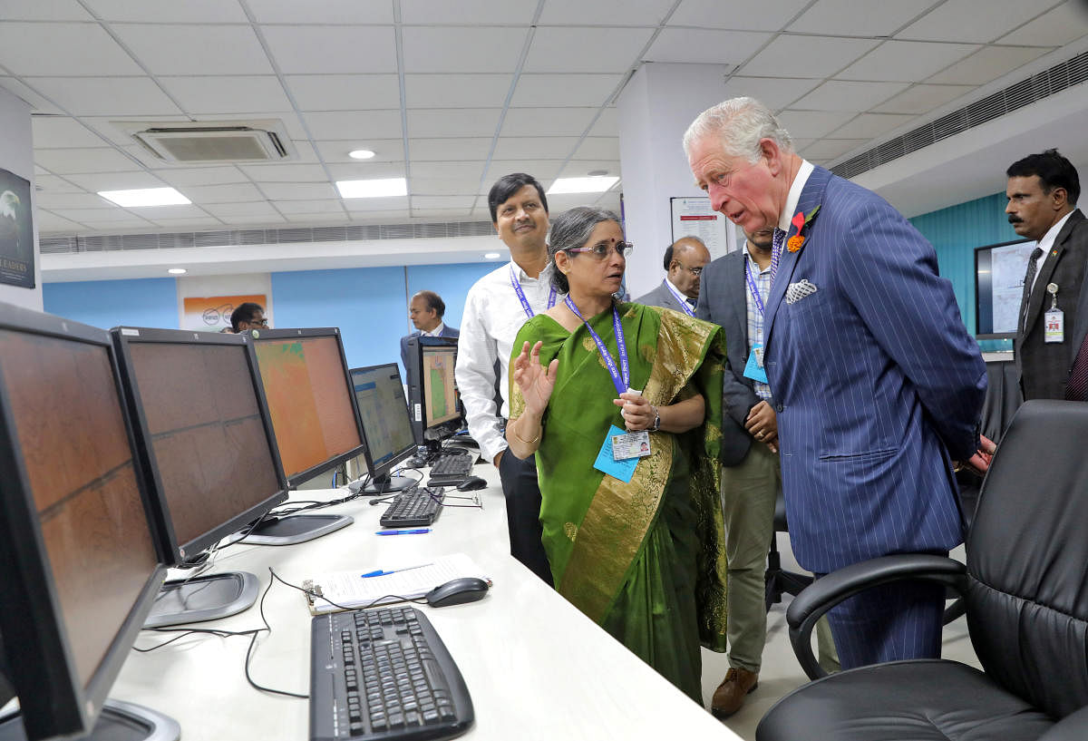 Britain's Prince Charles is briefed by an official during his visit to Indian Meteorological Department (IMD) in New Delhi, India, November 13, 2019. (Photo by Reuters)