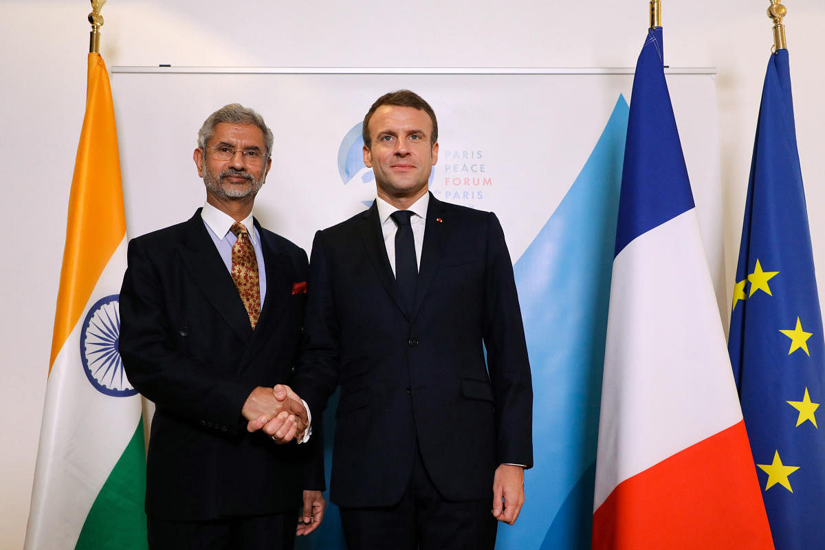 French President Emmanuel Macron, right, shakes hands with Indian Foreign Secretary Subrahmanyan Jaishankar during a meeting as part at the Paris Peace Forum. (AP/PTI Photo)