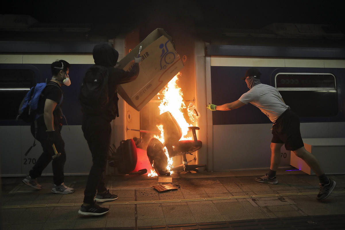  Students burn a train inside the Chinese University MTR station in Hong Kong, Wednesday, Nov. 13, 2019. (AP/PTI Photo)