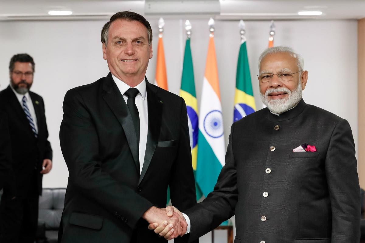  Brazilian President Jair Bolsonaro (L) and India's Prime-Minister Narendra Modi (R) shaking hands during a bilateral meeting (AFP Photo)