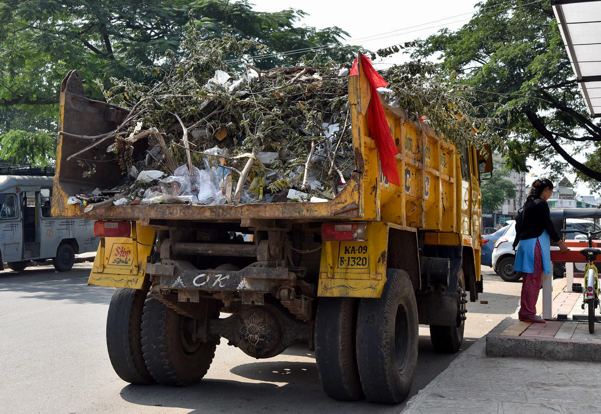 Unclear garbage and vehicles are is seen, near MCC office in Mysuru on Thursday. - PHOTO / SAVITHA B R