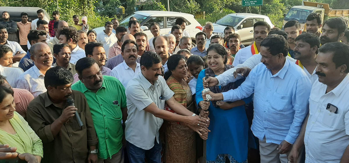 Virajpet MLA K G Bopaiah performs the ground-breaking ceremony for the widening of Ammatti-Meenupete Road on Wednesday.
