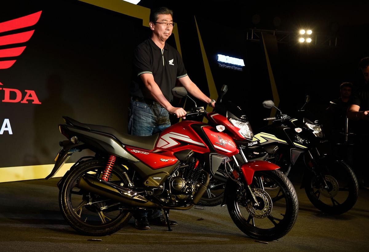 President, CEO and Managing Director, Honda Motorcycle and Scooter India Pvt. Ltd Minoru Kato poses for a photograph with the newly launched BSVI motorcycle (SP 125 BSVI), in New Delhi. PTI