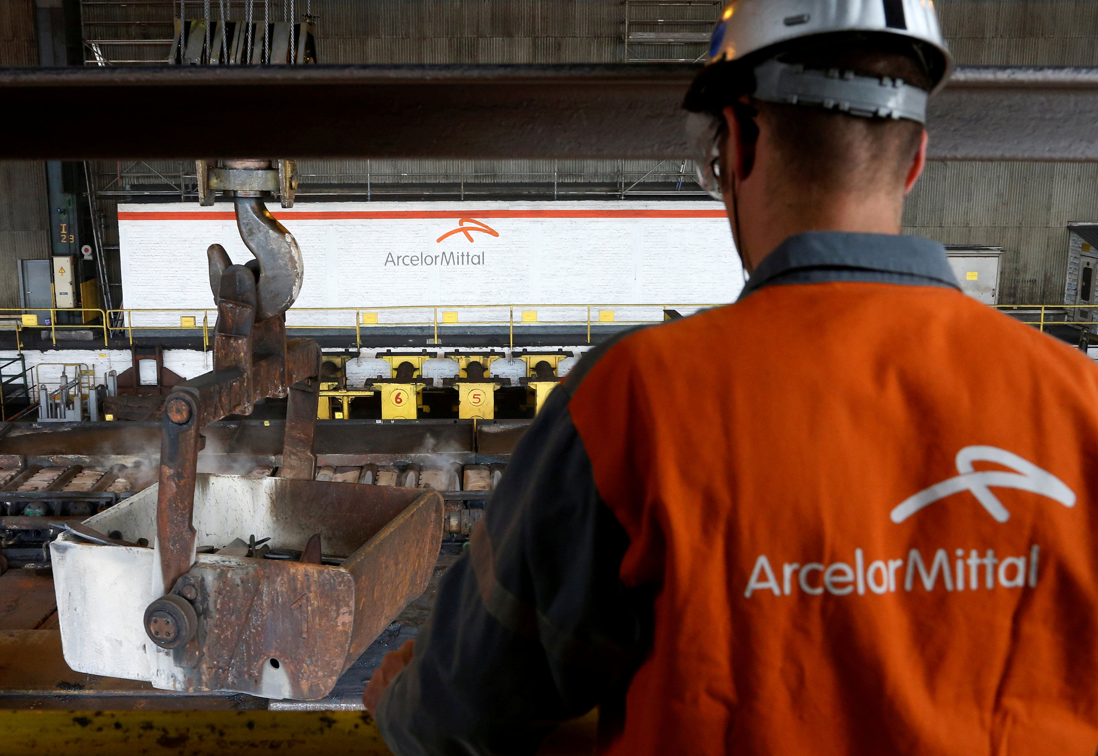 A worker surveys the production process at the ArcelorMittal steel plant. (Reuters Photo)