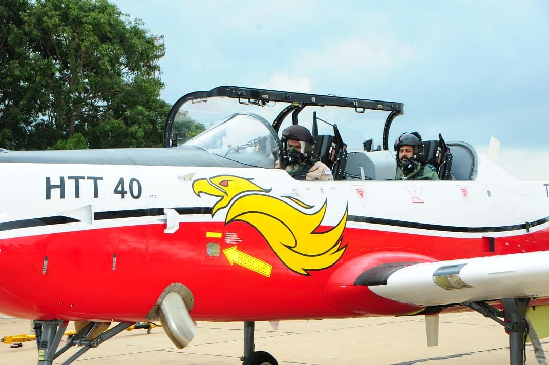 Air Chief Marshal R K S Bhadauria, Chief of the Air Staff test flies the newly developed HAL HTT-40 basic trainer, with HAL's chief test pilot Group Captain (retired) K K Venugopal, sitting in front. (DH Photo)