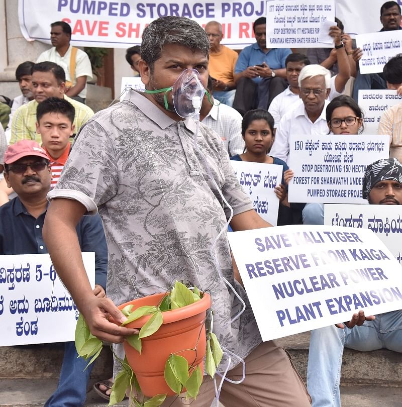 Members of United Conservation movement, Citizens and Environment lovers campaigning “Save Western Ghats” during their protest against Sharavathi underground pumped storage project, Kaiga Nuclear Reactors and Power Line to Goa, in front of Town hall in Bengaluru. (DH Photo)