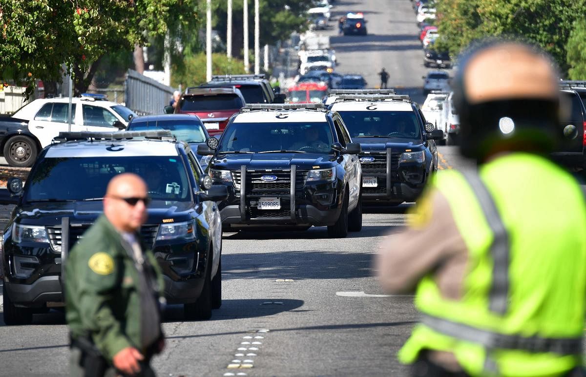 Law enforcement officials are seen outside Saugus High School at Central Park in Santa Clarita, California. (AFP Photo)