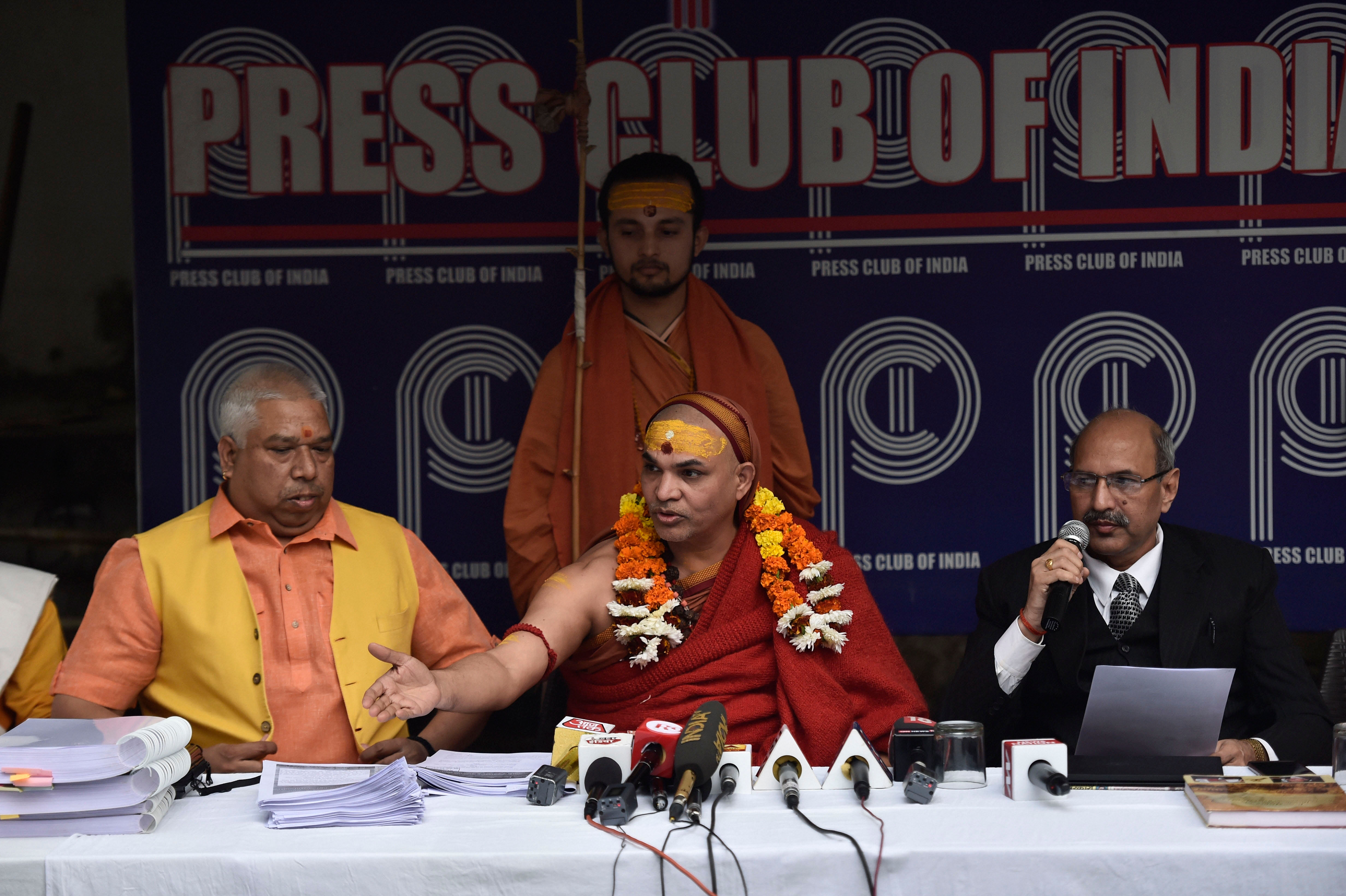 Ramalya Nyas Secretary Swami Avimukteshwaranand Saraswati (C), P N Mishra (L) and Ajay Gautam during a press conference on Ram Janambhoomi Temple construction issue, at Press Club of India in New Delhi. (PTI Photo)