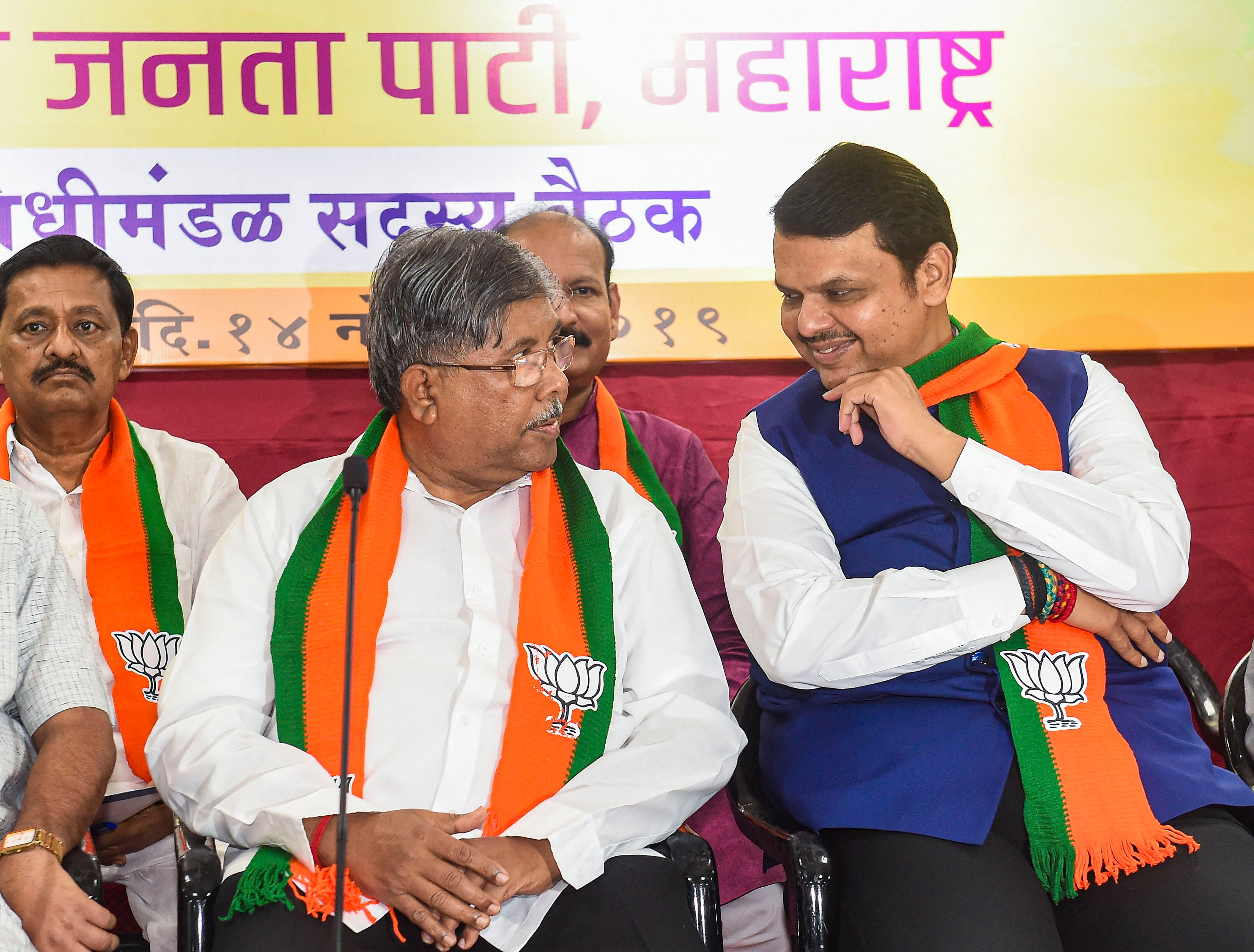 Maharashtra BJP President Chandrakant Patil and former chief minister Devendra Fadnavis. (PTI Photo)