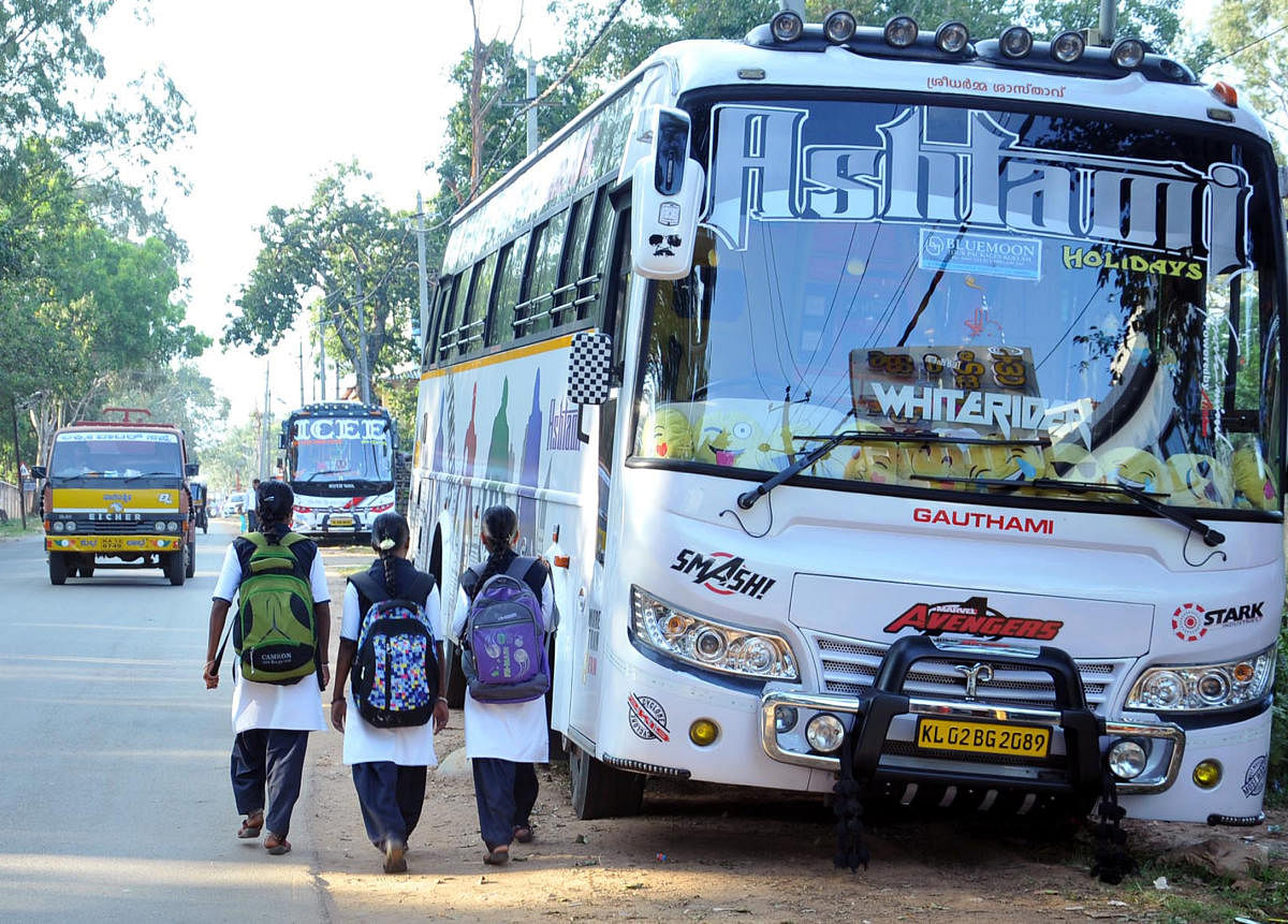 Students are forced to walk on the road as tourist vehicles are parked on the roadside in Chikkamagaluru.