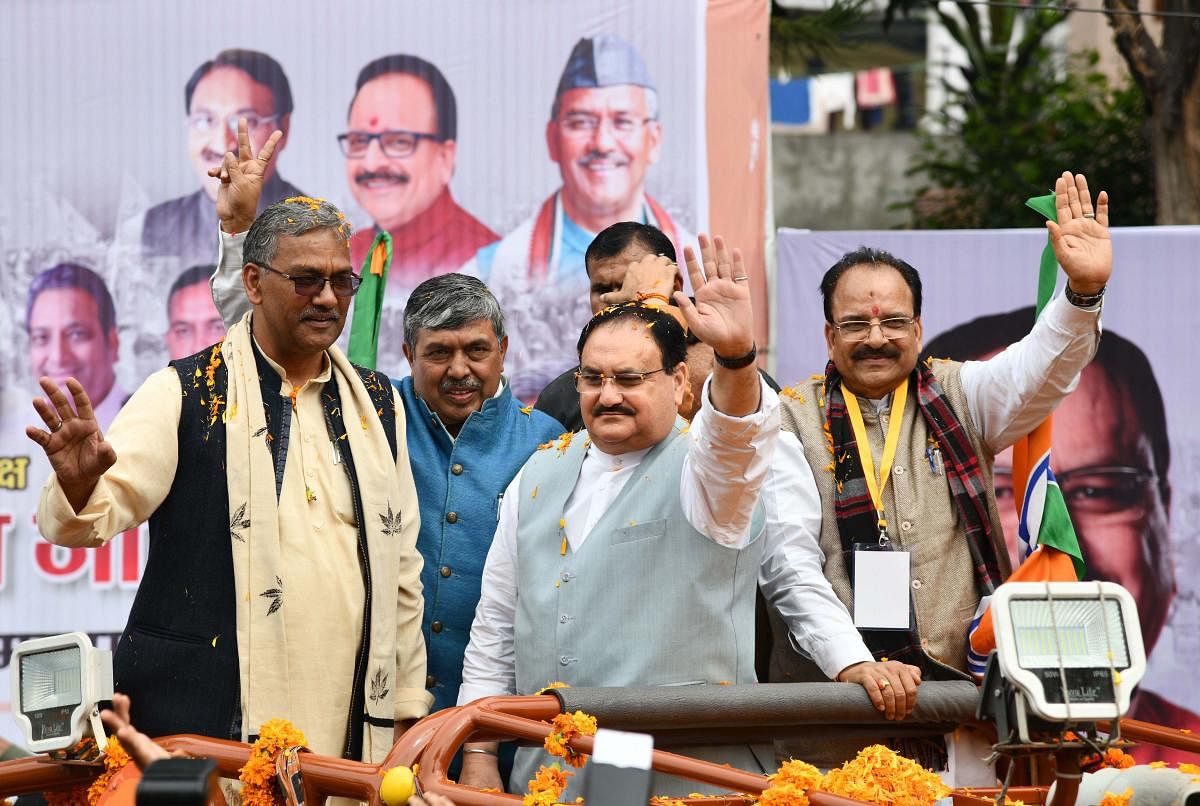 BJP working President J P Nadda, Uttarakhand Chief Minister Trivendra Singh Rawat and party's state chief Ajay Bhatt are greeted on their arrival at BJP state office, in Dehradun. PTI