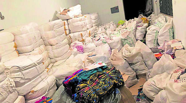 Sarees seized from a godown in Mysuru on Friday. (DH Photo)
