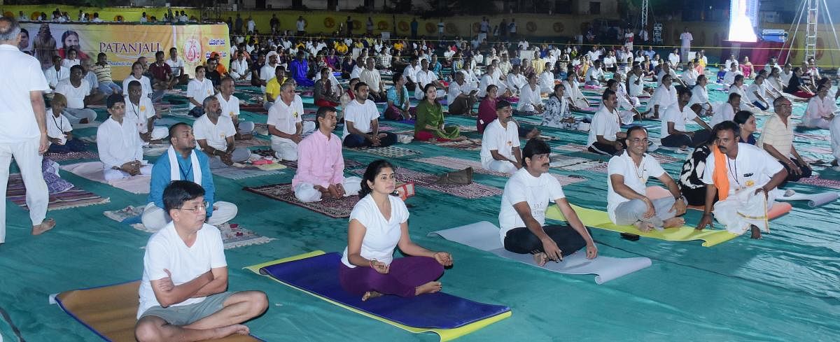 Yoga enthusiasts take part in the five-day Yoga camp organised by Paryaya Palimaru Mutt at parking area of the Sri Krishna Mutt in Udupi.