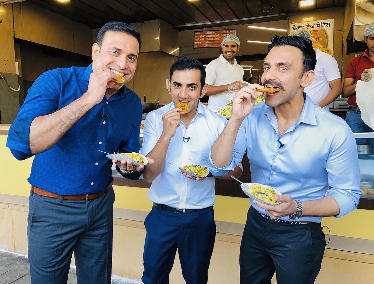 Photo posted on the official twitter account of former cricketer VVS Laxman on Friday, Nov. 15, 2019, shows Laxman, cricketer-turned-politician Gautam Gambhir and broadcaster Jatin Sapru eating 'Jalebis' and 'Pohe' for breakfast, in Indore, Saturday, Nov.