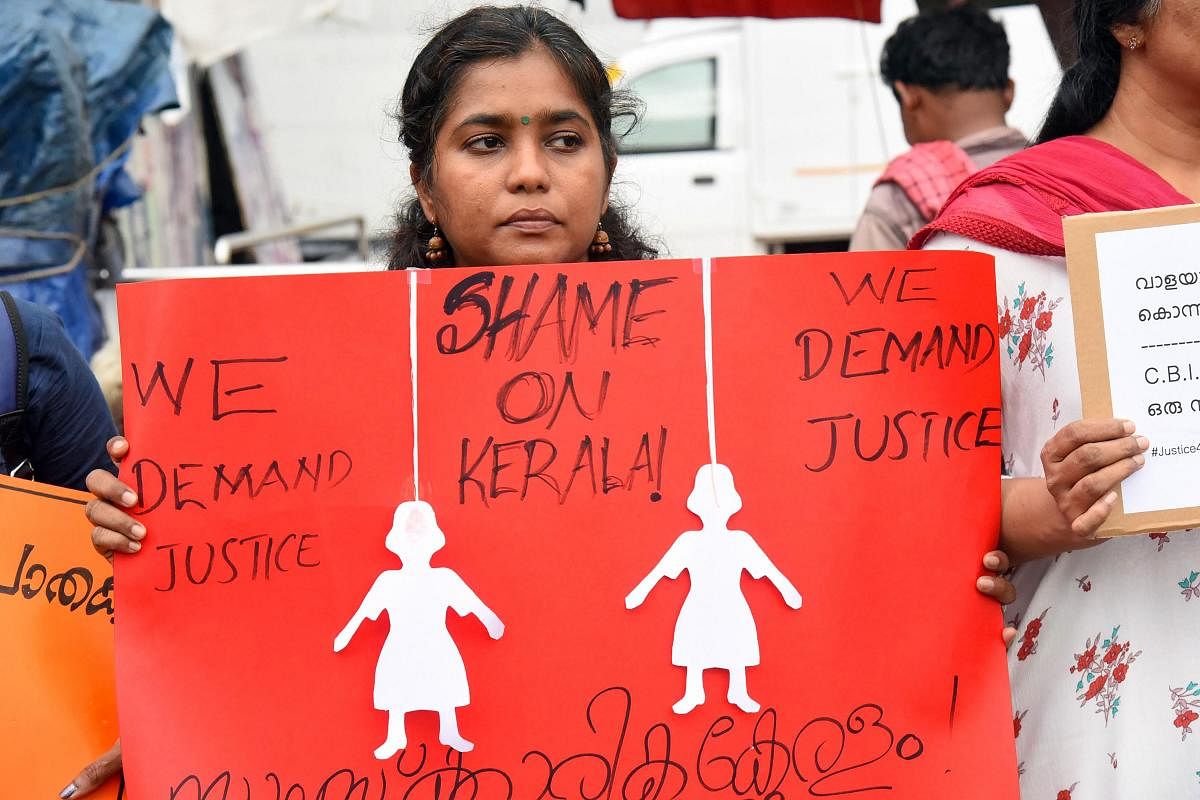 A woman protests against 'Walayar Sisters' case, in Kochi. (PTI Photo)