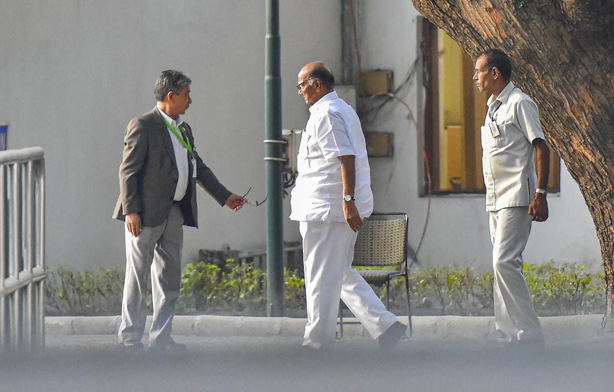 NCP chief Sharad Pawar arrives at the residence of Congress President Sonia Gandhi to discuss government formation in Maharashtra, in New Delhi.  (PTI Photo)