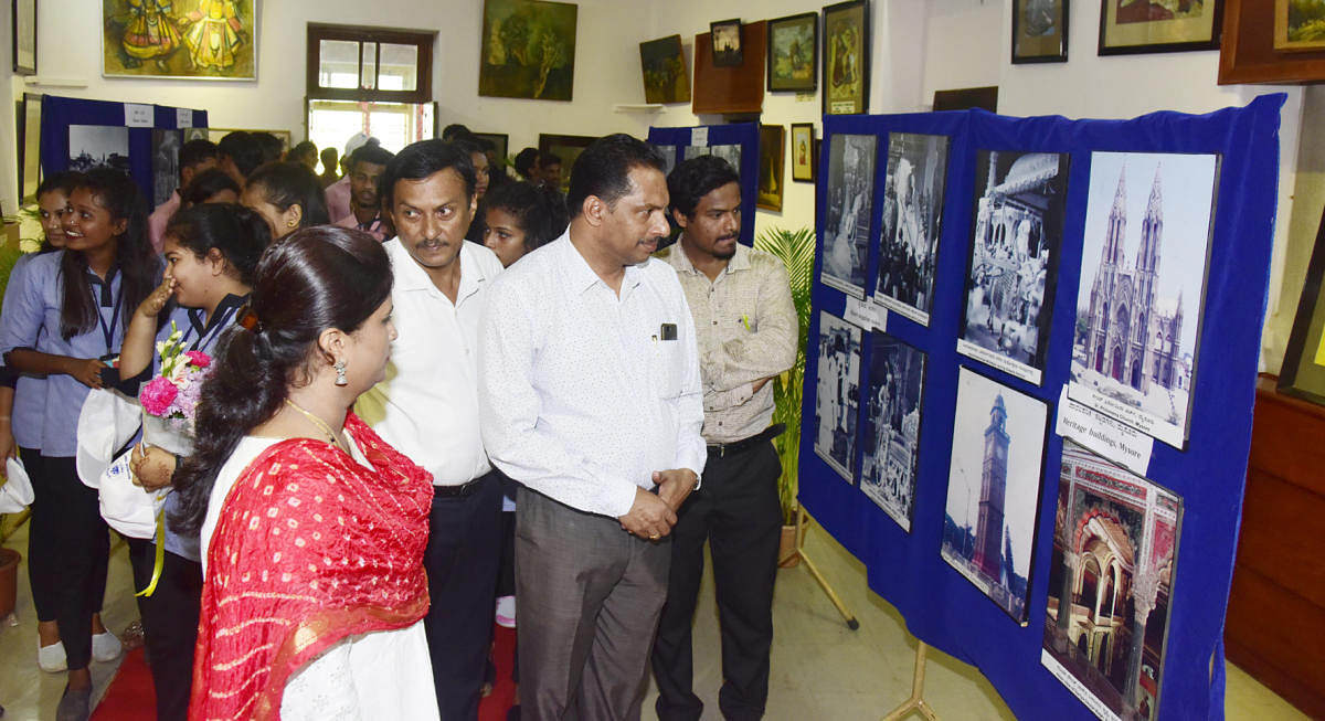 Guests and students look at rare photographs of the Kingdom of Mysore at Srimanthi Bai Memorial Government Museum in Bejai, Mangaluru, on Monday.