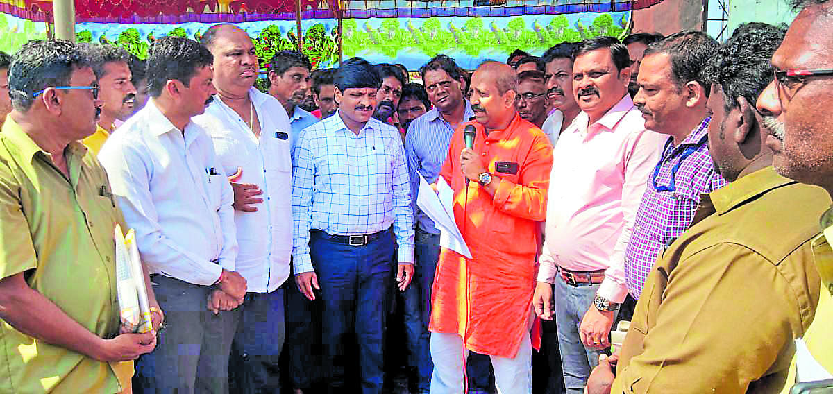 Udupi MLA K Raghupathi Bhat addresses autorickshaw drivers during a protest organised against the RTO near the deputy commissioner’s office in Manipal on Monday.