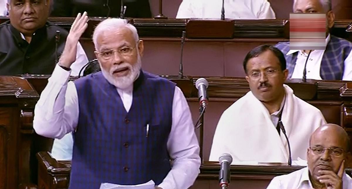 Prime Minister Narendra Modi speaks in the Rajya Sabha on the first day of the Winter Session of Parliament, in New Delhi. PTI