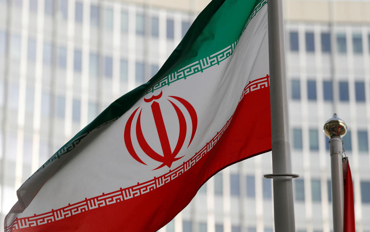 The Iranian flag flutters in front the International Atomic Energy Agency (IAEA) headquarters in Vienna. Photo/Reuters