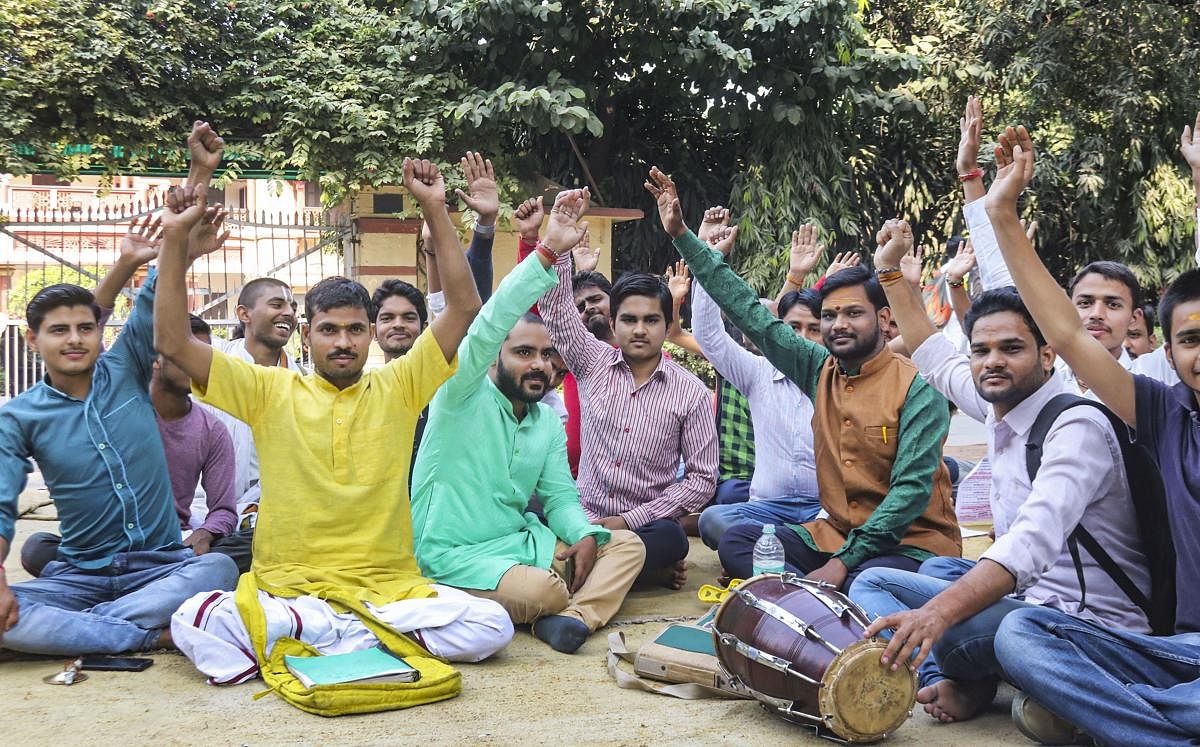 Students stage a protest dharna at the Banaras Hindu University (BHU) against the appointment of a Muslim teacher of Sanskrit at the universirty, in Varanasi, Wednesday, Nov. 20, 2019. (PTI Photo)