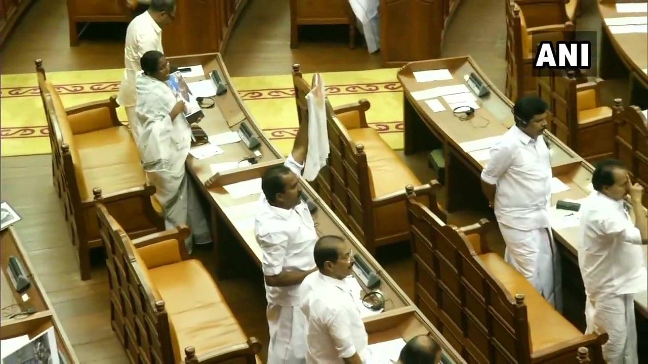 The Opposition, Congress-led United Democratic Front, on Wednesday disrupted proceedings of the Kerala Assembly by staging a strong protest against the police action against Congress MLA Shafi Parambil on Tuesday. (ANI photo)
