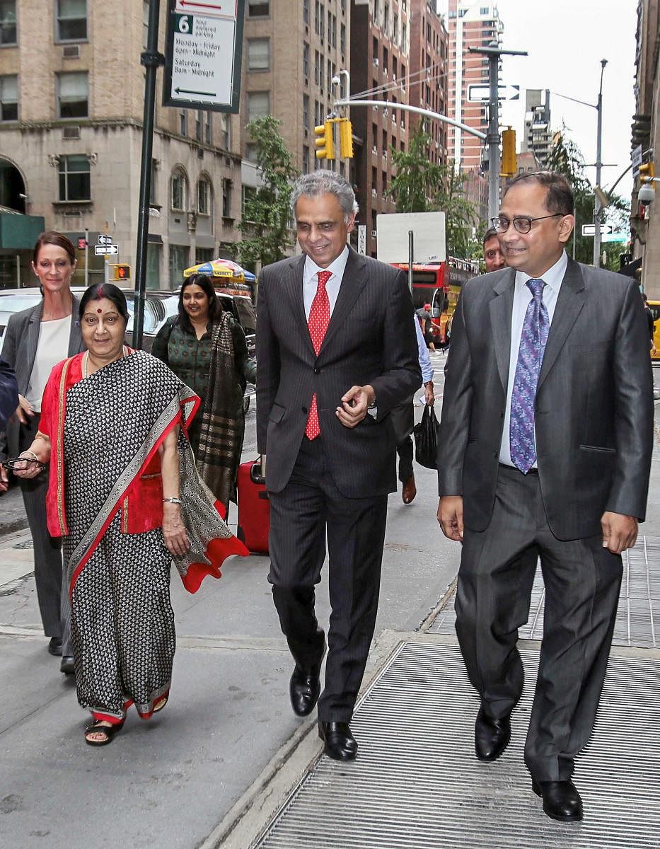 External Affairs Minister Sushma Swaraj being received by India's Permanent Representative to the UN Ambassador Syed Akbaruddin (C) and India's Consul-General in New York Ambassador Sandeep Chakravorty (R) on her arrival, in New York for UNGA. (PTI File P