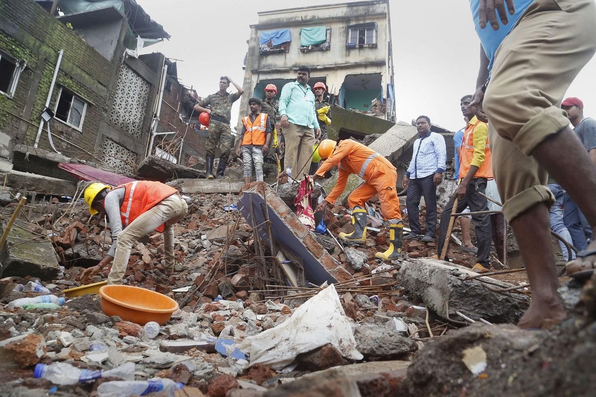 Bhiwandi: Rescue operations underway after a building collapsed in Bhiwandi city near Thane, Saturday, Aug 24, 2019. (PTI Photo)(PTI8_24_2019_000107B)