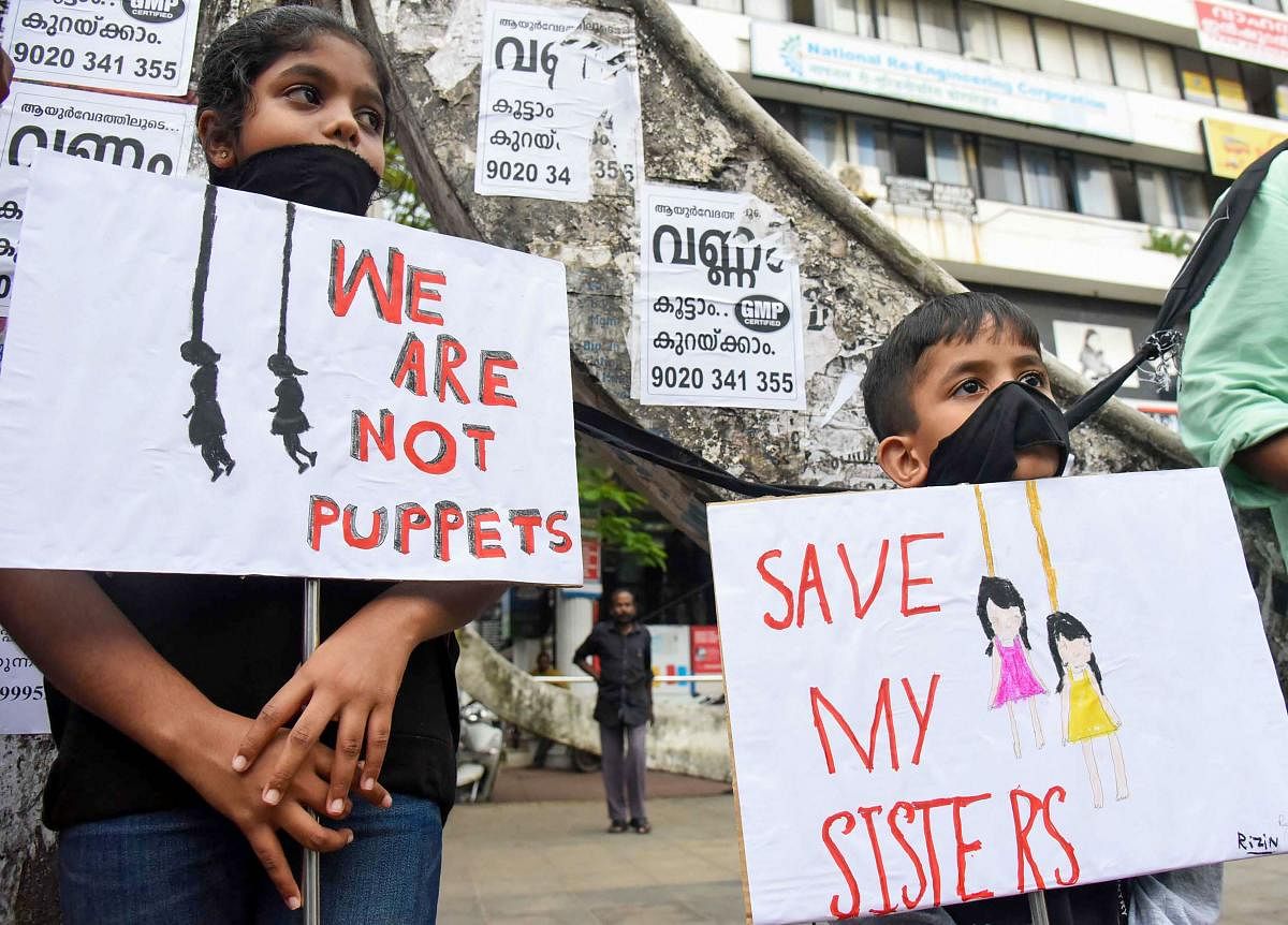Children protest against 'Walayar Sisters' case, in Kochi. (PTI Photo)