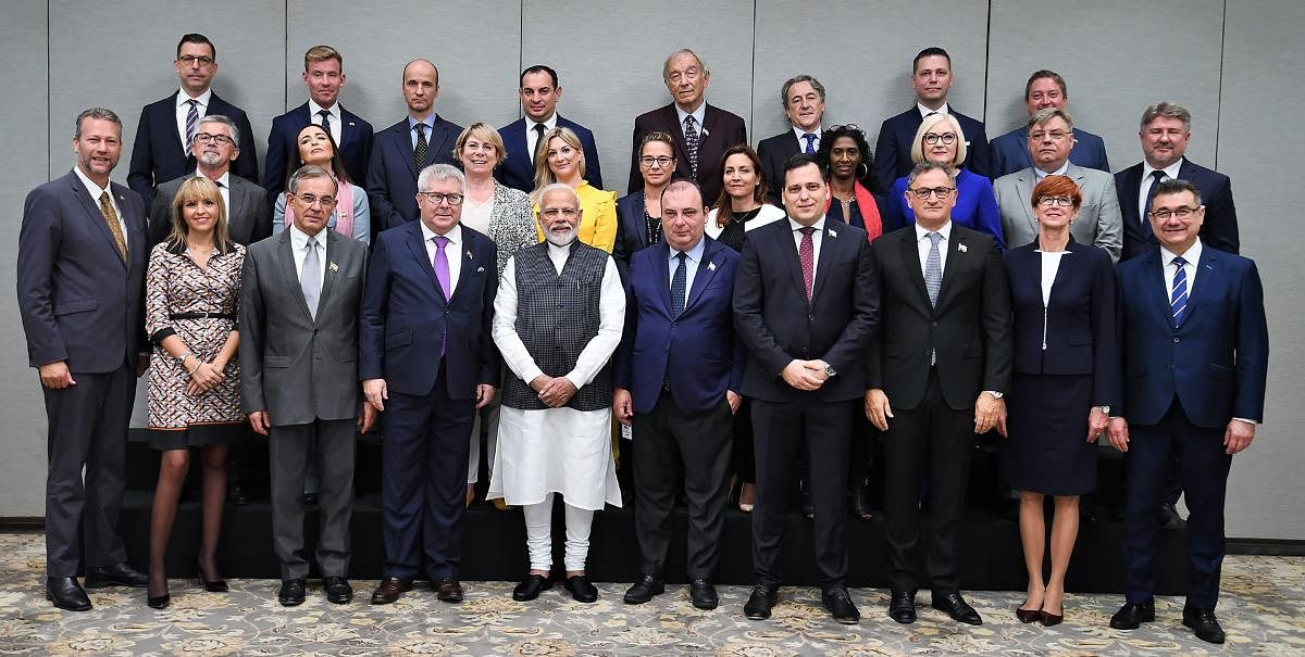 India's Prime Minister Narendra Modi posing for a group photograph with members of the European Parliament in New Delhi. (Photo by AFP)