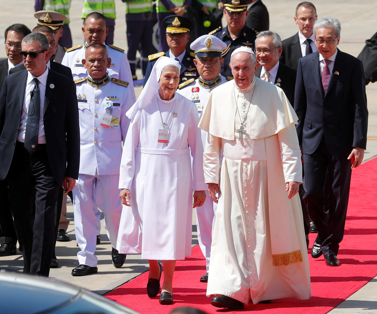 Pope Francis flanked by a Salesian nun Ana Rosa Sivori, who is his cousin, arrives at a military air terminal in Bangkok, Thailand November 20, 2019. (Photo by Reuters)