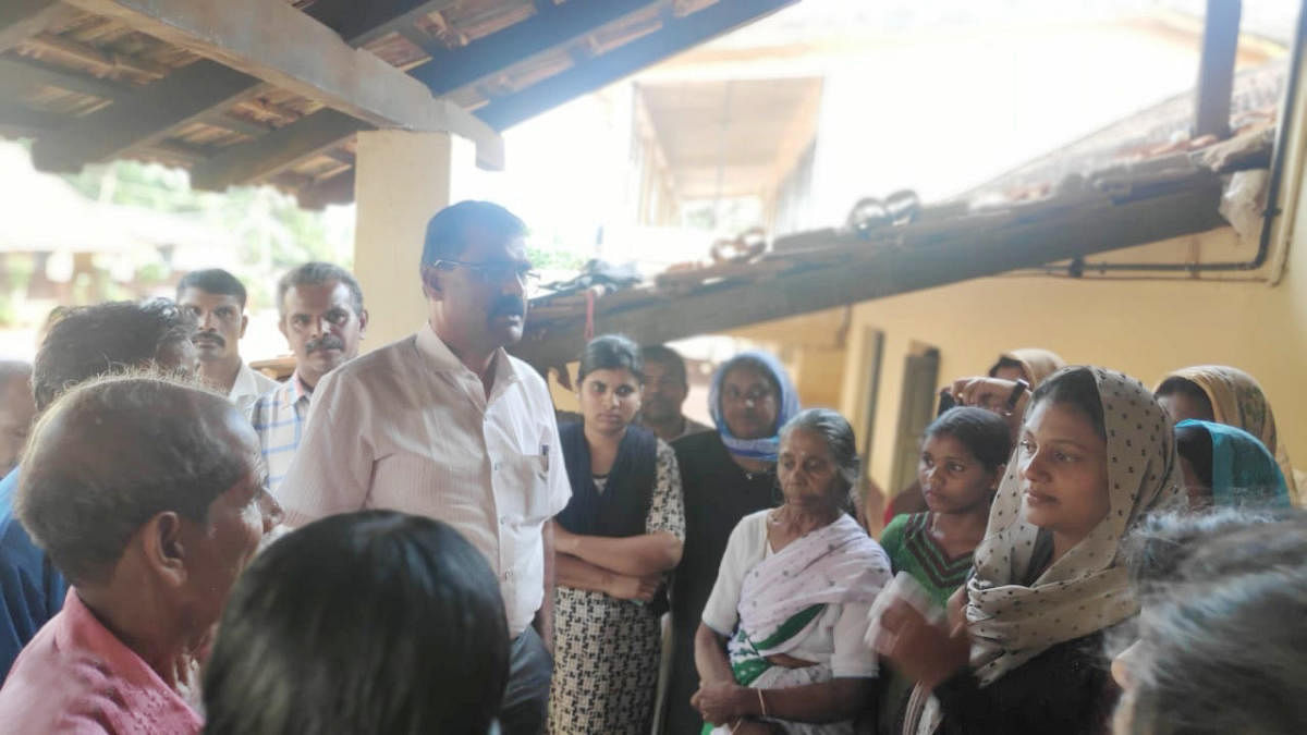 Assistant Commissioner Javaregowda interacts with the inmates of the relief centre in Nelyahudikeri on Wednesday.