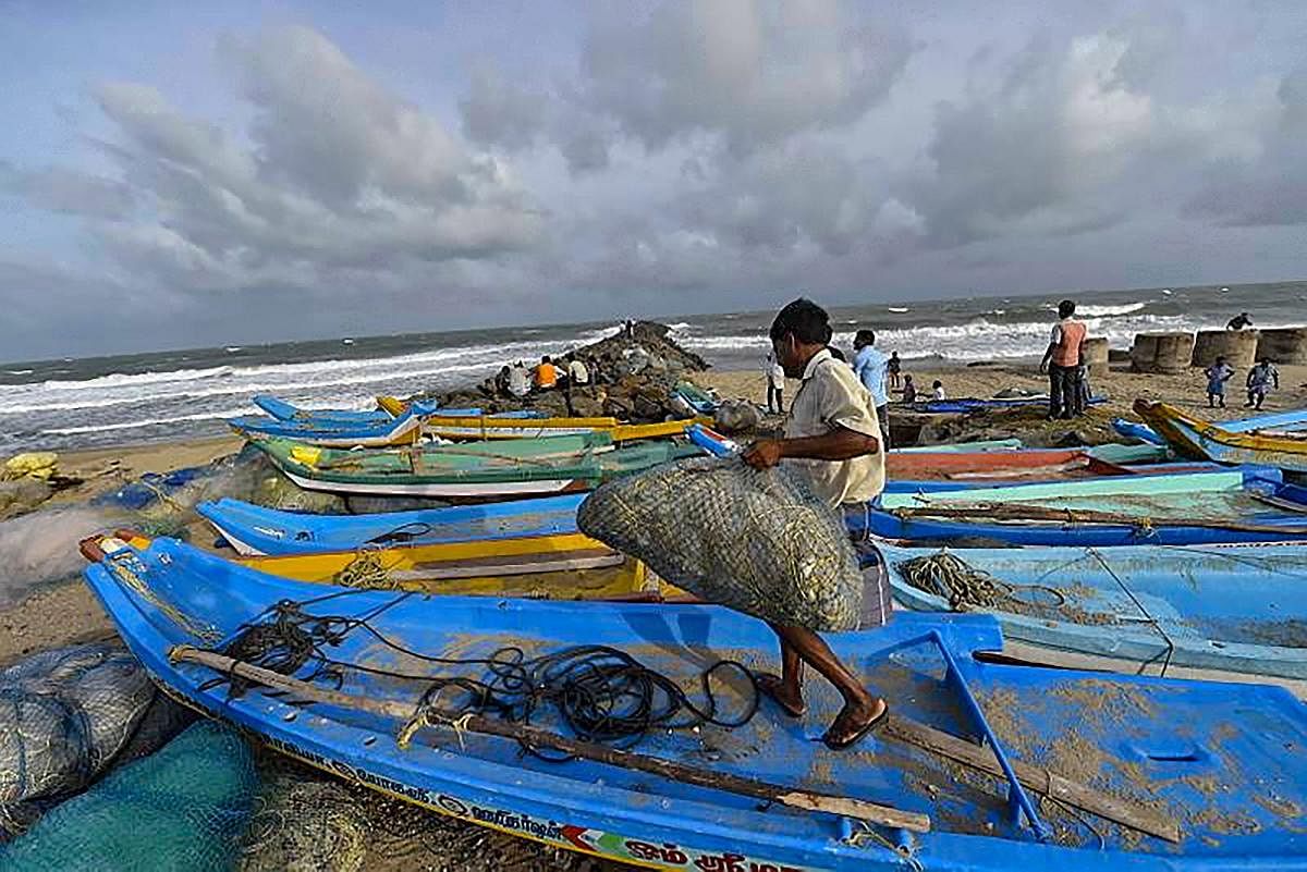 Chennai: Fishermen dock their boats as a precautionary measure ahead of the arrival of cyclone 'Gaja', in Chennai, Thursday, Nov. 15, 2018. Cyclone 'Gaja' intensified into a severe cyclonic storm and is expected to cross the south Tamil Nadu coast by late