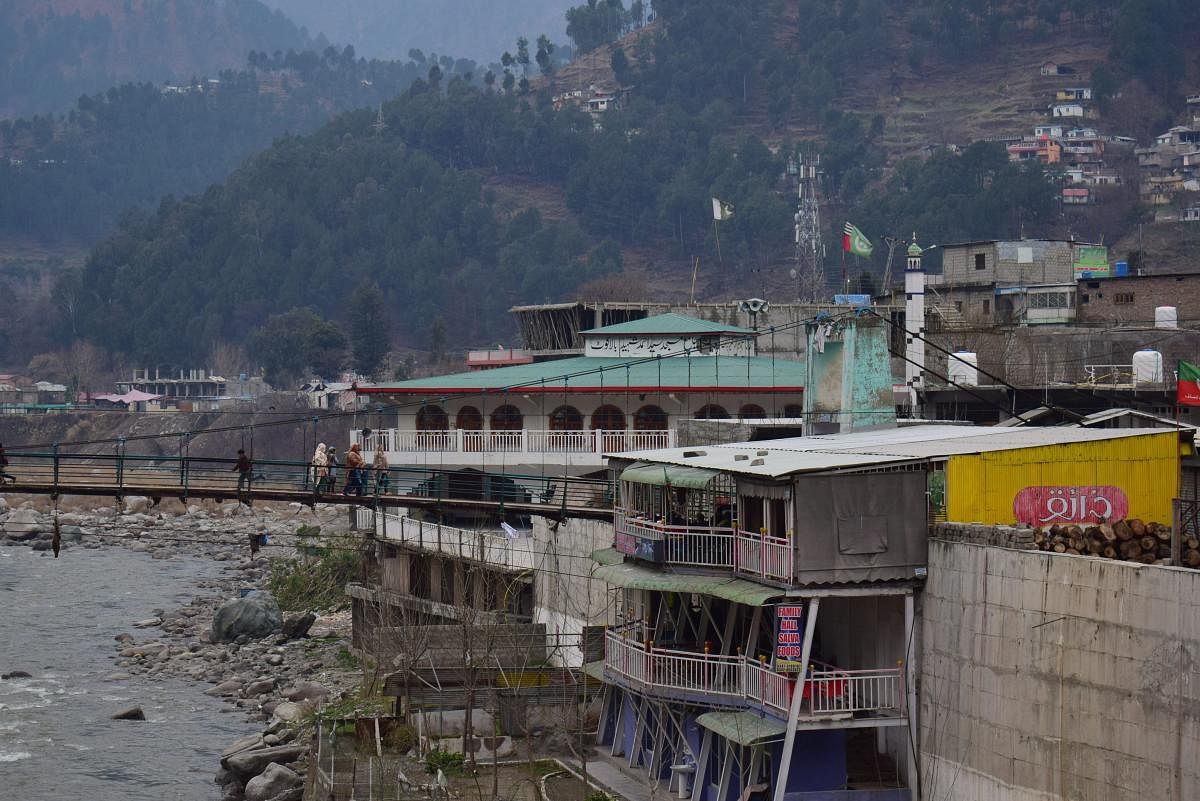 Balakot: Pakistan villagers cross a bridge in Balakot, Pakistan. (AP/PTI)