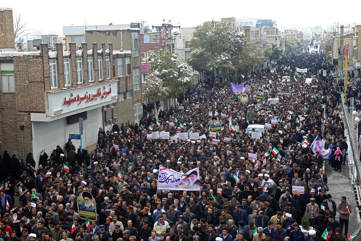 Iranians take to the streets in support of the Islamic republic's government and supreme leader, Ayatollah Ali Khamenei, in the central city of Arak, southwest of the capital Tehran, on November 20, 2019. (AFP Photo)