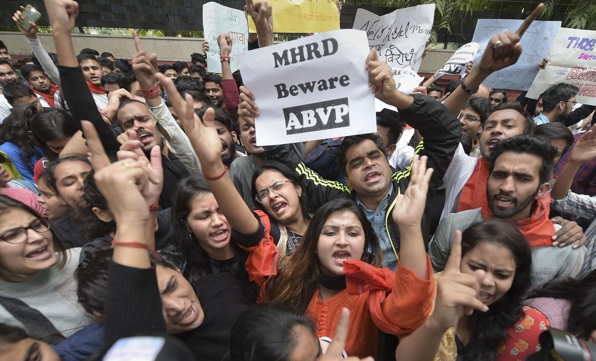 Jawaharlal Nehru University (JNU), Akhil Bharatiya Vidyarthi Parishad (ABVP) and Delhi University Students' Union (DUSU) students raise slogans during a protest march from Mandi House towards Jantar Mantar pressing for their demands. (PTI Photo)